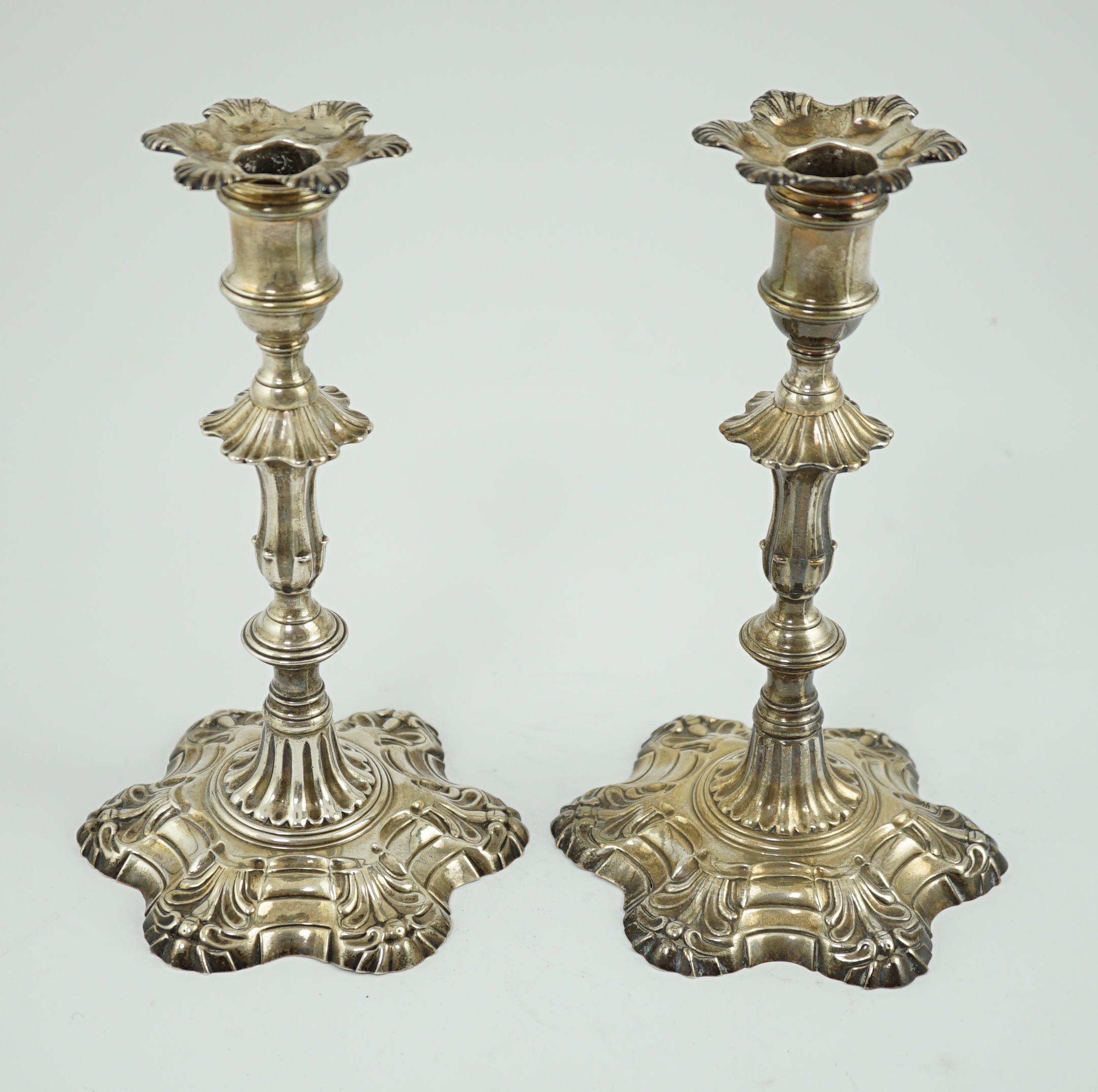 A pair of early George III cast silver candlesticks, by William Cafe